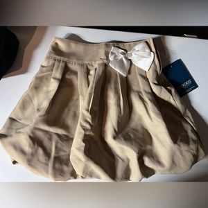 Cherokee scooter. School uniform skort. Khaki color white bow. Size 8 NWT